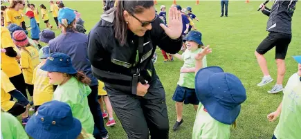  ?? PHOTO: FAIRFAX MEDIA ?? Four-time world champion shotputter, Valeria Adams encourages young children to get active and play sport.