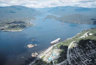  ?? JONATHAN HAYWARD THE CANADIAN PRESS ?? Aerial view shows Kinder Morgan's Trans Mountain marine terminal, in Burnaby, B.C., earlier this year.