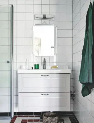  ??  ?? BATHROOM
The wall-hung vanity unit creates a feeling of space above the tiled floor design. The Chatsworth vanity in Traditiona­l White, £219.95, Victorian Plumbing, has a similar look