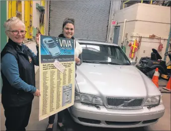  ?? SUEANN MUSICK/THE NEWS ?? Debra MacNabb, left, director of the Nova Scotia Museum of Industry, and Erika Smith, curator of collection­s, hold a poster that was on display when the 1999 Volvo S70 was raffled off by the IWK-Grace hospital as fundraiser. The Volvo is the last of...