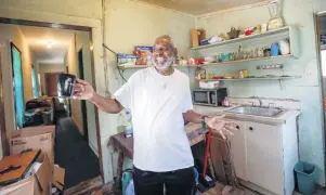  ?? ?? Charles Cratit, 69, has lived in the cottage at 4614 Brooker St., since he was a child and welcomes plans to renovate and preserve the houses. He will be able to keep paying $650 a month rent.