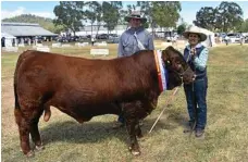  ??  ?? James and Kath McUtchen with their Grand Champion south devon bull.