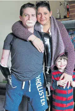  ?? Pictures: SOLENT ?? Alex Lewis with his fiancee Lucy Townsend and son Sam, top, after the operation. Alex with medical tattooist Karen Betts, left, who matched his facial skin