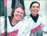  ?? SUBMITTED PHOTO ?? Rochelle Dickie (left) and Leanne Dulle smile in the locker room Sunday at their weekly hockey practice.