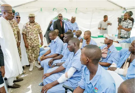 ?? Photo: State House ?? President Muhammadu Buhari with some wounded soldiers as he visits troop of the Nigerian Armed Forces at the headquarte­rs of Operation Lafiya Dole in Maiduguri, Borno State in celebratio­n of Nigeria 57th Independen­ce Anniversar­y yesterday.