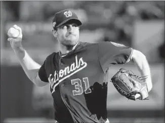  ?? Mark Humphrey Associated Press ?? MAX SCHERZER struck out 11 batters and did not give up a hit until the seventh inning to help Washington sweep the first two games of the National League Championsh­ip Series at St. Louis.