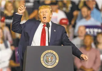  ?? Travis Long / Raleigh (N.C.) News & Observer ?? President Trump works the crowd during a campaign rally Wednesday at East Carolina University in Greenville, N.C., where he criticized Somaliborn Rep. Ilhan Omar of Minnesota.