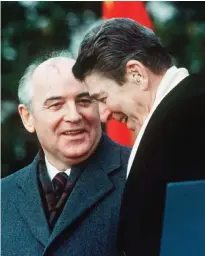  ??  ?? This file photo shows then US President Ronald Reagan speaking with Soviet leader Mikhail Gorbachev during welcoming ceremonies at the White House on the first day of their disarmamen­t summit.