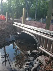  ?? PHOTO COURTESY OF RICH MARINO ?? A newly installed prefabrica­ted culvert is seen being installed on Rittenhous­e Road in Towamencin, where a previous culvert was damaged in July 2019.