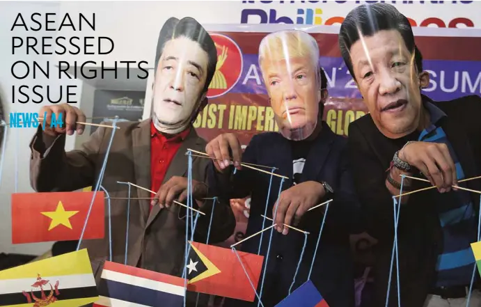  ?? EDWIN BACASMAS ?? LUNETA PROTEST Militants wear masks of Japanese Prime Minister Shinzo Abe, US President Donald Trump and Chinese President Xi Jinping during a protest at Luneta Park in Manila, accusing the leaders of plunder and militariza­tion in member-states of the...