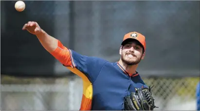  ?? DAVID GOLDMAN — THE ASSOCIATED PRESS FILE ?? In this 2015 photo, Mark Appel throws the ball during a spring training workout while a member of the Houston Astros. Appel turned out to be one of the biggest busts in Major League Baseball history after he was selected first overall in 2013and failed to ever play in a big league game.