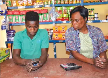  ??  ?? Humba Investment­s shop attendants at Bambazonke Business Centre operating SCOPE cards for food payments to households in Marange