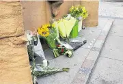  ??  ?? Floral tributes were left in the town centre on the first anniversar­y of the tragedy