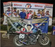  ??  ?? Cory Texter, center, is joined by his G&G Racing crew in victory lane after winning the AFT Production Twins season championsh­ip Saturday at the Meadowland­s Mile in East Rutherford, N.J.