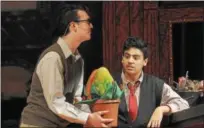  ?? GENE WALSH — DIGITAL FIRST MEDIA ?? Matt Zippy, left, holds Audrey II as Donny Marte looks on during a dress rehearsal of “Little Shop of Horrors” at Pottstown High School.