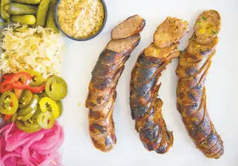  ?? CHRIS KAUFMAN ?? West Oak Nosh in downtown Lodi features a sausage board with pickled onions and sauerkraut.