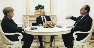  ?? MAXIM ZMEYEV/AFP ?? German Chancellor Angela Merkel, left, Russian President Vladimir Putin, centre, and French President François Hollande sat down in
Moscow to discuss salvaging a peace plan agreed upon last year.