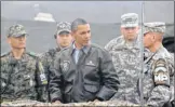  ??  ?? FIRST VISIT: President Obama meets personnel at the buffer zone between the two Koreas.