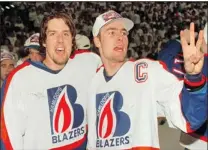  ?? PNG FILES ?? Then- Blazers Darcy Tucker ( right) and Tyson Nash celebrate the WHL team’s third Memorial Cup championsh­ip in 1995.