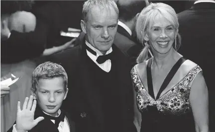  ?? CARL DE SOUZA/AFP/ GETTY IMAGES ?? Sting, seen in 2006 with wife Trudi Styler and son Giacomo, said this month that he won’t be leaving any of his US$300 million to his six children so it won’t be an ‘albatross’ around their neck. Warren Buffett is giving 99 per cent of his fortune to...