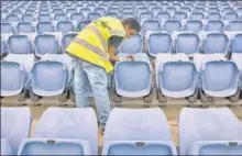  ?? GETTY IMAGES ?? Mr Cleaner: Wiping seats at a stadium in Sydney, Australia n