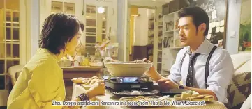  ??  ?? Zhou Dongyu and Takeshi Kaneshiro in a scene from ‘This Is Not What I Expected’.
