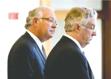  ?? STAFF PHOTO BY ERIN O. SMITH ?? LaFayette, Ga., attorney Larry Hill, left, who was indicted last month for trying to convince a witness to lie in a child molestatio­n case, and his defense attorney Chris Townley stand before the judge Monday for a hearing at the Walker County Superior...