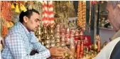  ??  ?? Shops outside the Ram temple selling religious items.