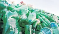  ?? PHOTO: REUTERS ?? Piles of plastic . . . Recycled plastic bottles are seen at Xa Cau village.