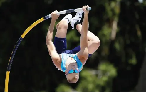  ??  ?? Sam Kendricks leaps to victory in the men’s pole vault final during Day 3 of the 2017 USA Track & Field Championsh­ips at Hornet Satdium on Saturday in Sacramento, California. (AFP)