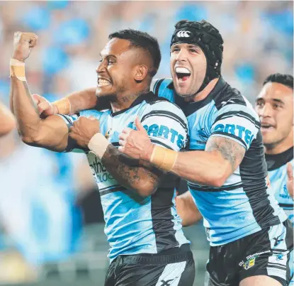  ??  ?? ATTACKING WEAPON: Ben Barba ( left) and Michael Ennis celebrate Barba’s try during the 2012 grand final.