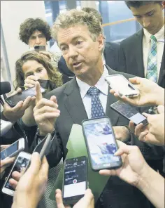  ??  ?? NAY FOR NOW: Sen. Rand Paul tells reporters on Thursday that he wouldn’t vote for the plan as it stands, but is willing to negotiate.