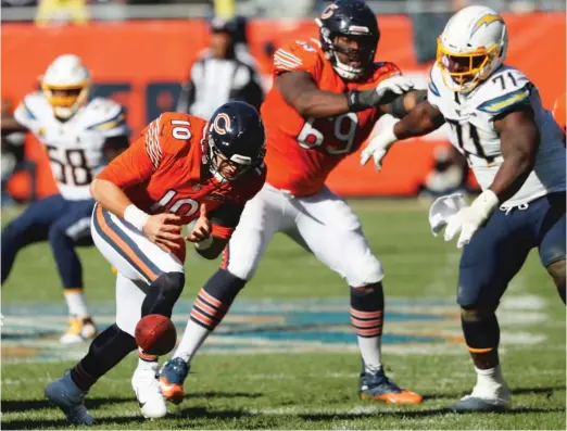  ?? CHARLES REX ARBOGAST/AP ?? A noncontact fumble by Mitch Trubisky was one of two costly turnovers he made in the fourth quarter. The fumble led to the Chargers’ go-ahead TD.