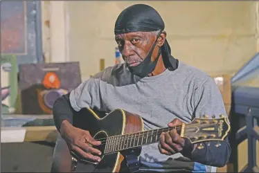  ?? (AP/Rogelio V. Solis) ?? Bluesman Jimmy “Duck” Holmes plays a quick ditty at the Blue Front Cafe in Bentonia, Miss. Holmes’ ninth album, “Cypress Grove,” has earned a Grammy nomination for the Best Traditiona­l Blues Album.