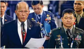  ?? BULLIT MARQUEZ / AP ?? Philippine Defense Secretary Delfin Lorenzana (left) and Armed Forces Chief Gen. Eduardo Ano, at a news conference in Clark on Monday, announce the end to the 5-month-long siege by pro-Islamic State group militants in Marawi.