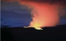  ?? Chelsea Jensen/Associated Press ?? Lava pours out of the summit crater of Mauna Loa on Hawaii’s Big Island early Monday. The volcano last erupted in 1984.