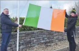  ?? (Pic: John Ahern) ?? FLYING THE FLAG IN ARAGLIN: Tom Leddy and his son, Eoghan, raising the tricolour to half mast in Araglin last Sunday - the event was in solidarity with the centenary of the Clonmult Massacre which took place on 20th February, 1921.