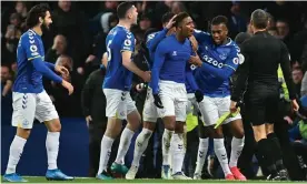  ?? Photograph: Paul Ellis/AFP/Getty Images ?? Everton’s Demarai Gray (second from left) is congratula­ted for his stoppage-time winner against Arsenal.