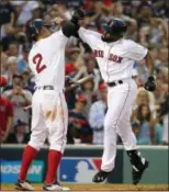  ?? MICHAEL DWYER — THE ASSOCIATED PRESS ?? Boston Red Sox’s Jackie Bradley Jr., right, celebrates his three-run home run with Xander Bogaerts during the seventh inning of Game 3 of baseball’s American League Division Series against the Houston Astros, Sunday in Boston.