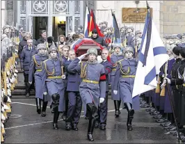  ?? SERGEI ILNITSKY / POOL PHOTO VIA ASSOCIATED PRESS ?? A coffin bearing the body of Andrei Karlov, the Russian ambassador to Turkey who was assassinat­ed Monday, is carried out of Foreign Ministry headquarte­rs in Moscow on Thursday, bound for a funeral service.