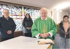  ?? Picture: Bev Lacey ?? FACE-TO-FACE: Ready to welcome parishione­rs back to St Thomas More's Catholic church are (from left) Michael Bermingham, Karen Gwynne and Fran Mitchell with Father Hal Ranger.