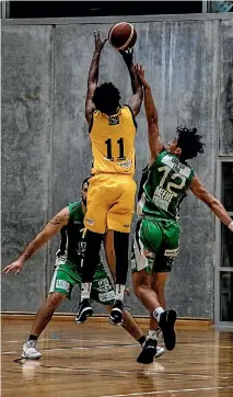  ??  ?? Taranaki’s Alonzo Burton goes up for a shot vs the Manawatu¯ Jets.