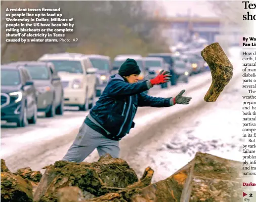  ?? Photo: AP ?? A resident tosses firewood as people line up to load up Wednesday in Dallas. Millions of people in the US have been hit by rolling blackouts or the complete shutoff of electricit­y in Texas caused by a winter storm.