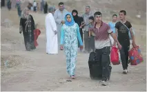  ??  ?? Iraqi citizens in Mosul are trapped by tough new restrictio­ns, which were imposed by Islamic State in stages starting last October.