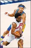  ??  ?? Indiana Pacers center Myles Turner, (top), fouls Toronto Raptors forward Stanley Johnson (5) during the second half of an NBA basketball game in Indianapol­is, on Jan 24. (AP)