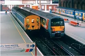  ?? ?? Photograph­ed in the first months of service in 1991 at London bridge (December 1991) shiny new No. 456002 stands alongside 2EPB No. 6326. They were allocated to Selhurst depot for operation on South London Lines duties in place of the 2EPB units, which were transferre­d elsewhere.