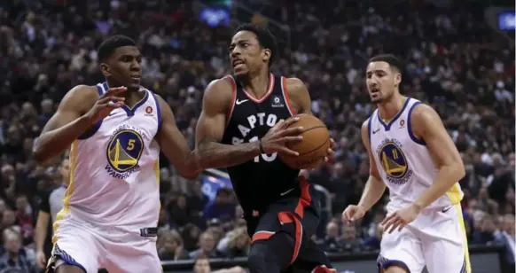  ?? RICHARD LAUTENS/TORONTO STAR ?? DeMar DeRozan heads to the basket during another big offensive night. The guard scored 42 points but the Warriors built a big enough lead to hold off DeRozan and the Raptors, barely.