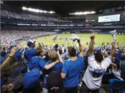 ?? CANADIAN PRESS FILE PHOTO ?? Fans celebrate following the Toronto Blue Jays series win over the Texas Rangers after Game 5 of American League division series last October. They’ve been waiting all winter to cheer again.