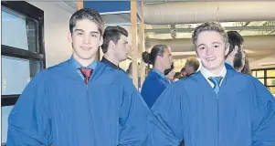  ?? MAUREEN COULTER PHOTO ?? Brett Allen of Warren Grove, left, and Logan Anderson of Nine Mile Creek lead the way for fellow graduates as they marched into the gym filled with family and friends at UPEI for their graduation ceremony June 23. Brett plans on attending Dalhousie...