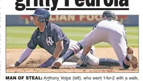  ?? AP ?? MAN OF STEAL: Anthony Volpe (left), who went 1-for-2 with a walk, slides under the tag of Ryan Kreidler to steal second base during the second inning of the Yankees’ 6-3 exhibition win over the Tigers.